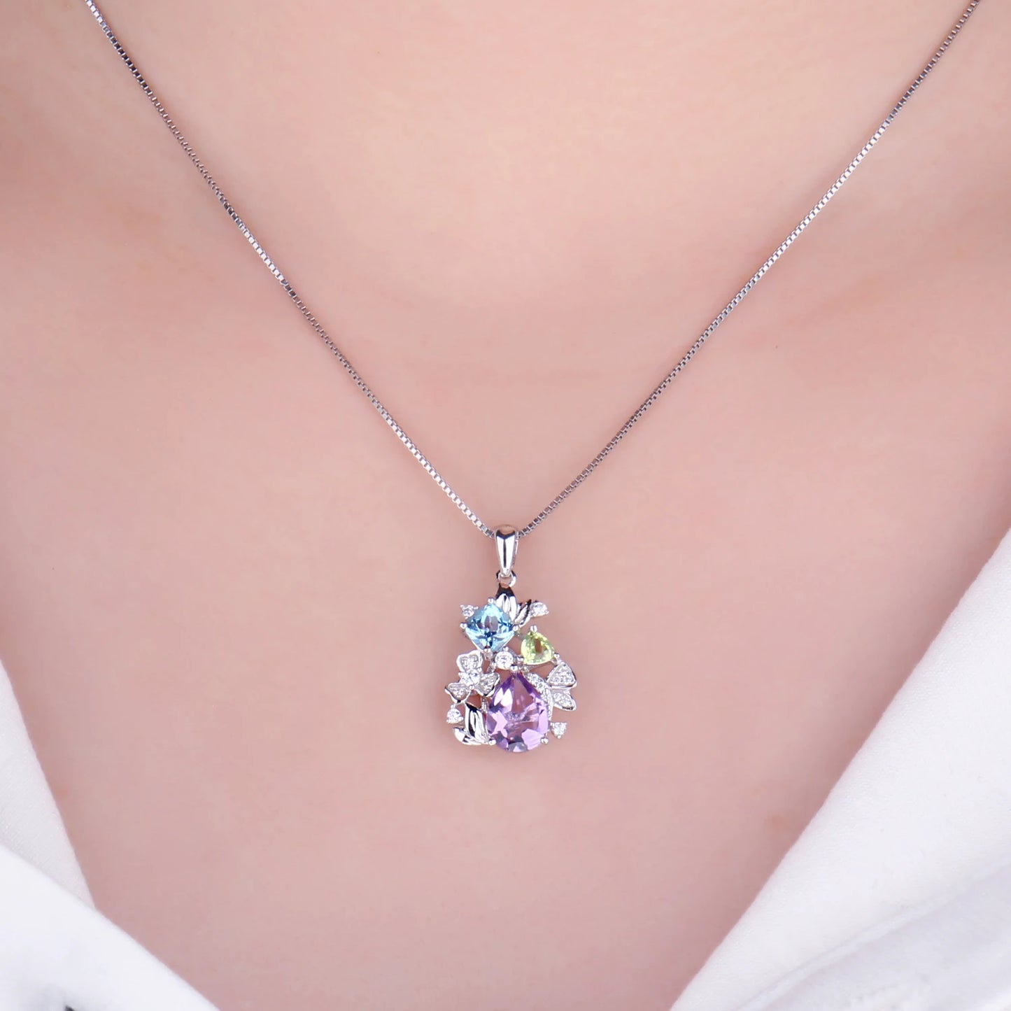 Elegant floral necklace crafted from 925 sterling silver and adorned with natural gemstones that add a touch of beauty and uniqueness.
Note: Chain not included.