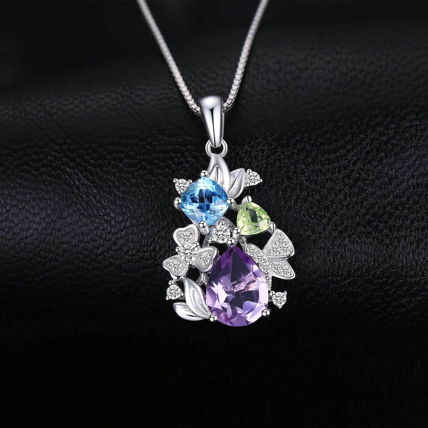 Elegant floral necklace crafted from 925 sterling silver and adorned with natural gemstones that add a touch of beauty and uniqueness.
Note: Chain not included.