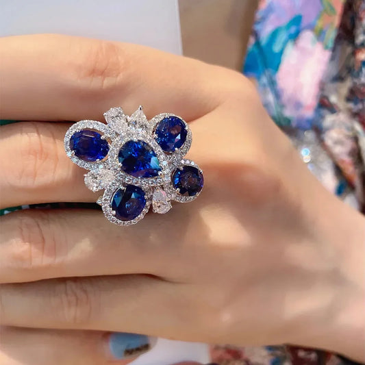 Luxury Blue Zirconia Rings With Geometric Floral Design - Adjustable And Perfect For Elegant Occasions
