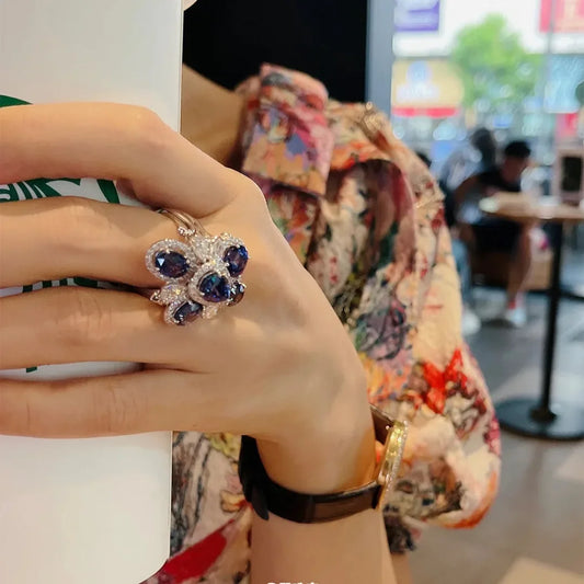 Luxury Blue Zirconia Rings With Geometric Floral Design - Adjustable And Perfect For Elegant Occasions