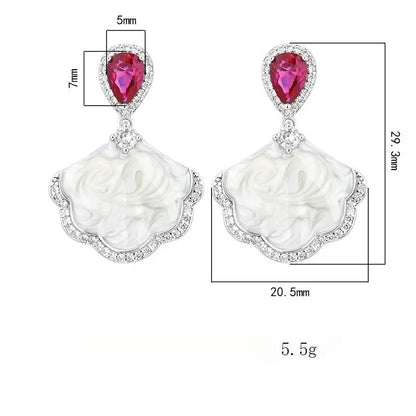 Luxury high-quality earrings made from natural shell and sparkling zircon.