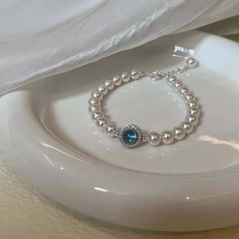 Elegant Pearl Bracelet with Blue Zircon Charm