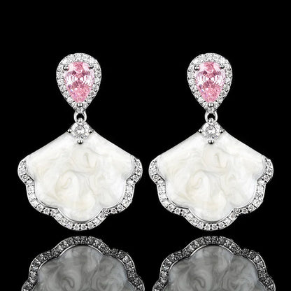 Luxury high-quality earrings made from natural shell and sparkling zircon.