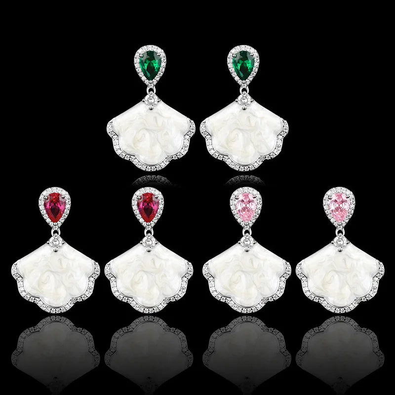 Luxury high-quality earrings made from natural shell and sparkling zircon.