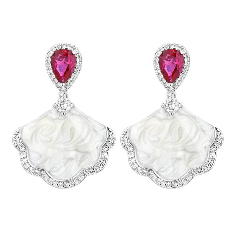 Luxury high-quality earrings made from natural shell and sparkling zircon.