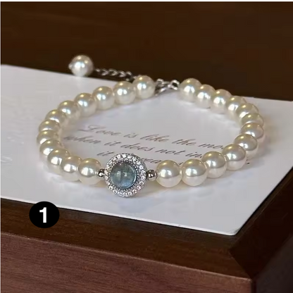 Elegant Pearl Bracelet with Blue Zircon Charm