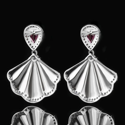 Luxury high-quality earrings made from natural shell and sparkling zircon.